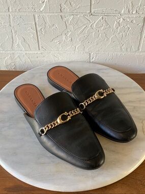 Coach Black Leather Mules with Gold Chain Accent